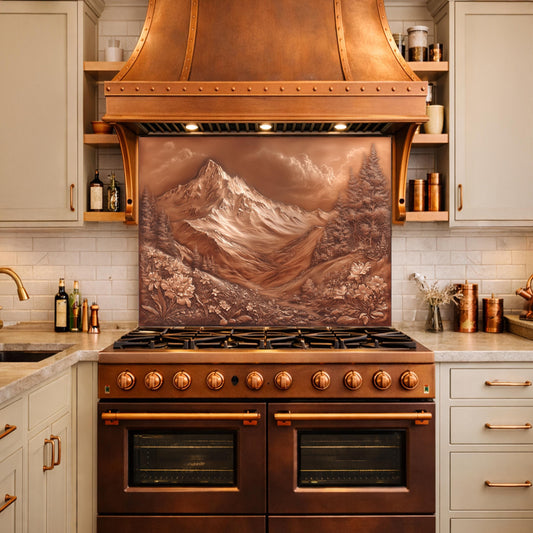 May include: A copper range hood and stove with a mountain landscape backsplash. The stove has six burners and two ovens. The range hood and backsplash are a warm copper color, and the cabinets are a light green.